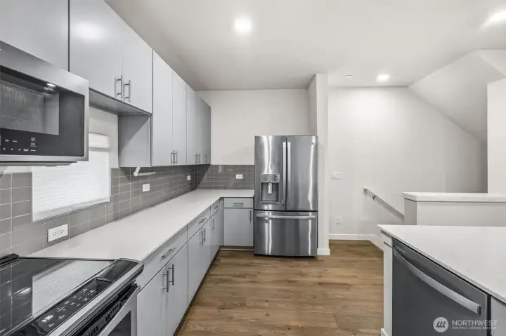 Kitchen looking back towards stairs to from door
