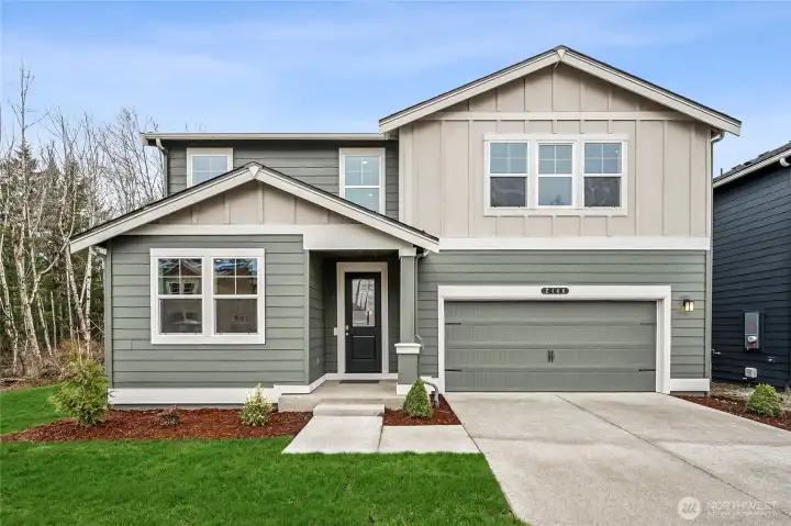 Stunning two story exterior with covered entry.