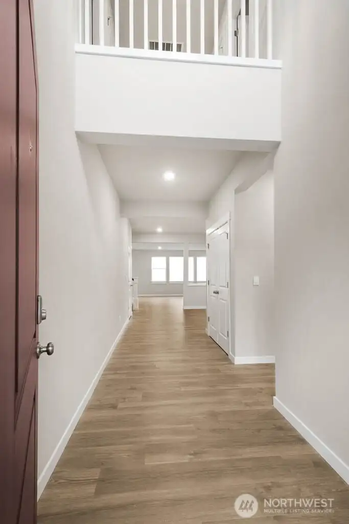 Entry with high ceilings. Pictures are for representational purposes only, colors and features may vary.