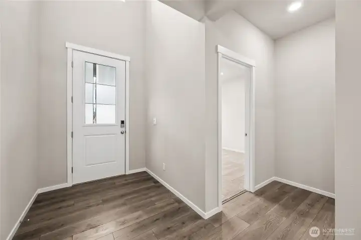 Inviting Entry with Glass in the door for added light.  This also shows the Downstairs Bedroom.