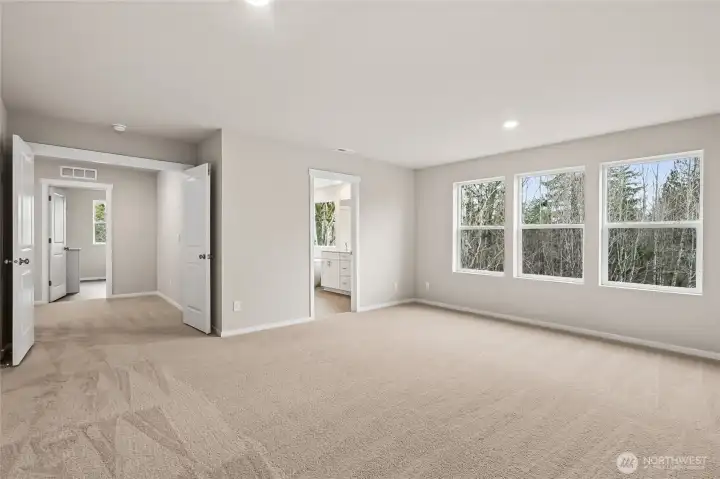 Primary Suite with En-Suite Bath, and French Door Entrance.