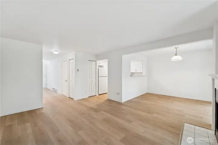 Living area w/ view from fireplace to entry way