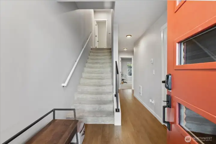 Enter on the lower floor where you'll find a large bedroom with greenbelt views & it's own en-suite.