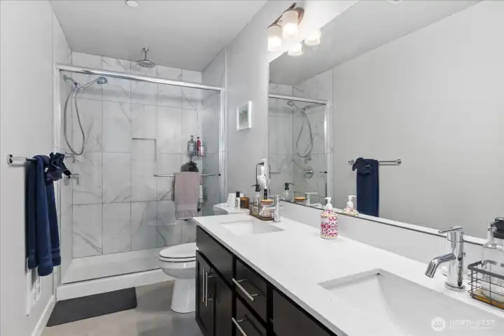 Primary en-suite with quartz counters, double sinks & walk-in shower!