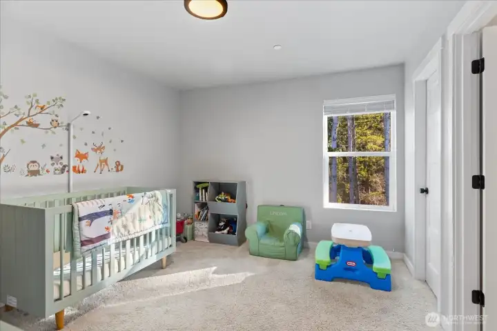 Second bedroom on 3rd level has greenbelt views, walk-in closet & private full bath!