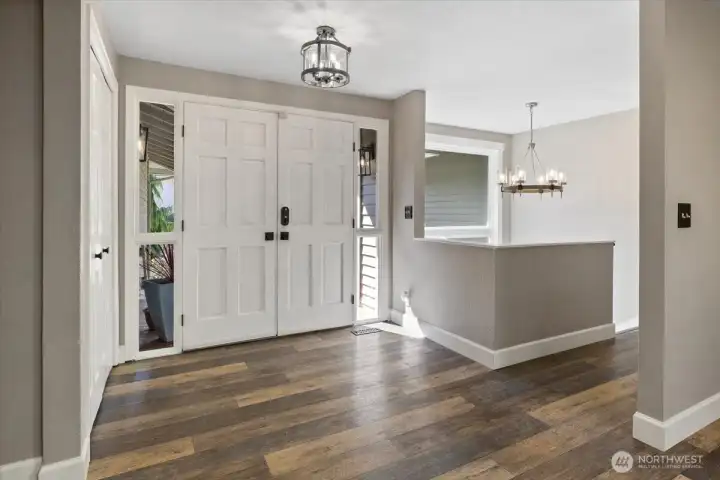 The stair lit, double door entry leads you inside with an open, inviting entry space! Side windows and stairway window brings in the warm sunlight!
