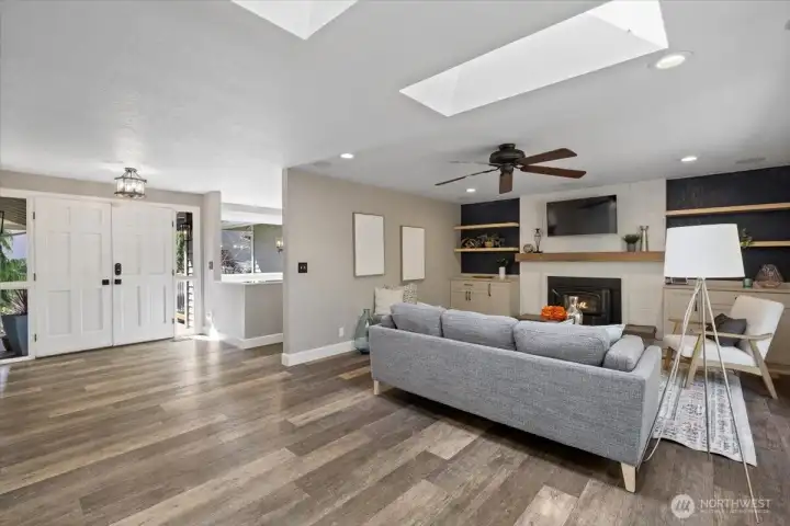 Newer LVP, Luxury Vinyl Plank, flooring throughout the main floor.  No scratching and waterproof! Strategically placed skylights open your living area up even more!