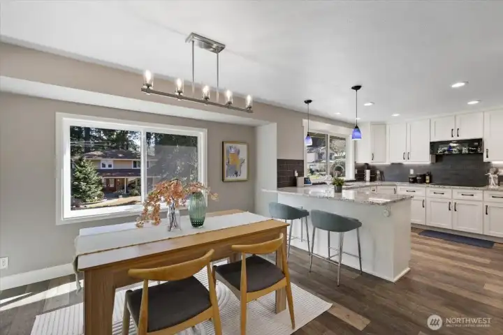 Modern lighting in this larger kitchen eating area, informal dining room!  The kitchen was opened up for that nice "flow" through feel.