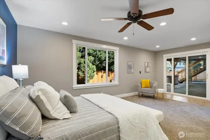 Sliders leading out to the patio and hot tub, backyard!  Built-in glass sliding doggie door!  Easily a second Primary bedroom!