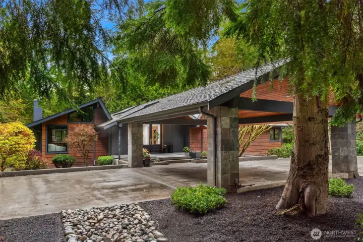 Welcoming circular drive with covered porte-cochere for seamless all weather arrival