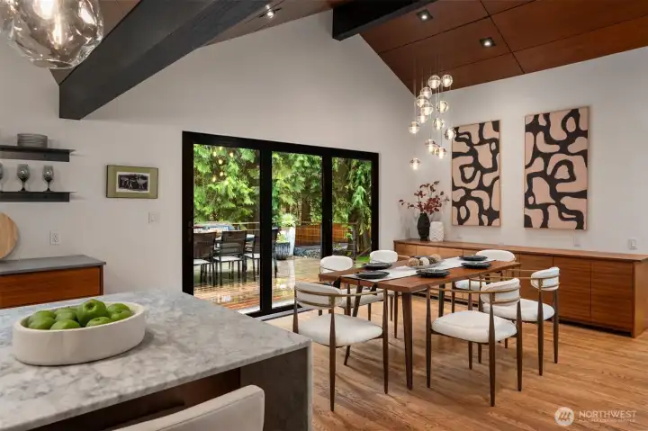 Dining area connecting to the kitchen and outdoor spaces
