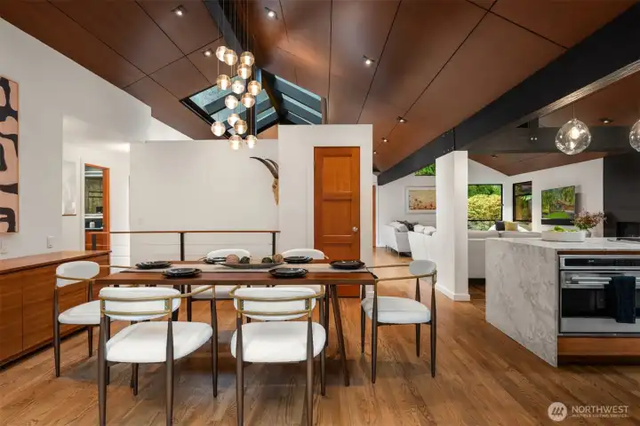 Statement Bocci pendant lighting anchors the dining space