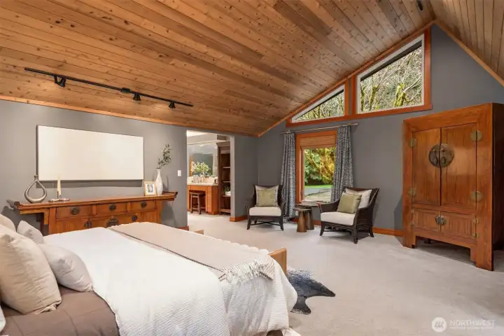 Primary suite with soaring fir-lined ceilings for a peaceful, private feel
