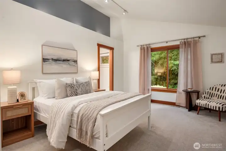 Bedroom with soft uplighting and an open feel