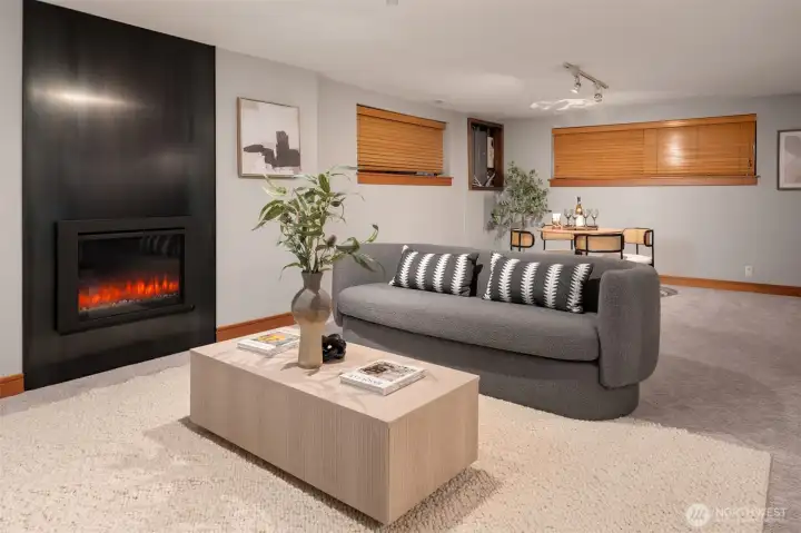 Lower level living area with a hot-rolled steel fireplace