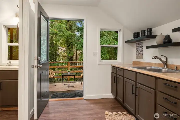 Well equipped with cabinetry, sink and adjacent bath