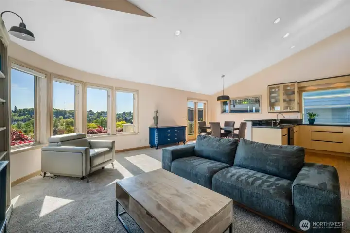 A dramatic surprise! Loads of natural light through a wall of windows flood this airy great room.