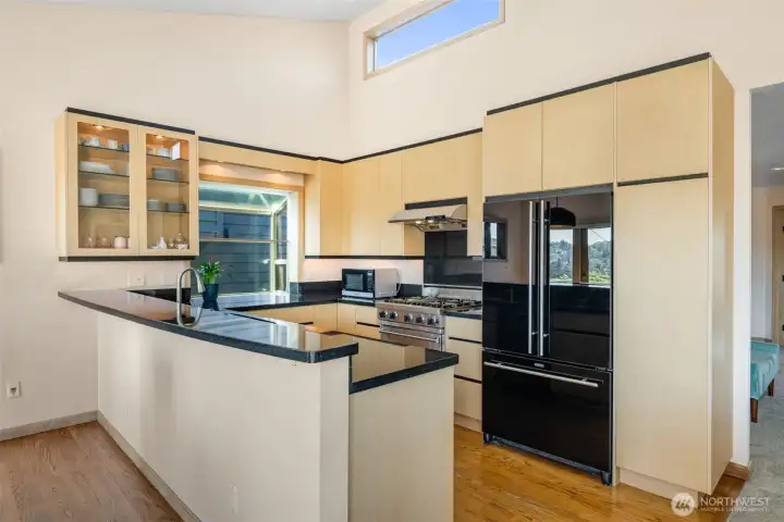 Form and function in this kitchen, with high-end appliances including a Viking range, bar space and formal dining.