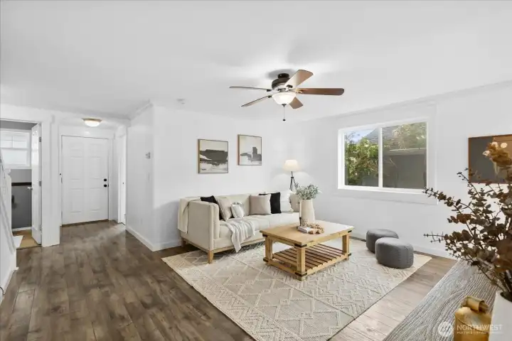 Another view of the living room looking back toward the entry and main floor bedroom.