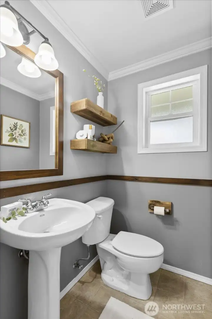 A bright and functional half-bath on the main floor for guests.