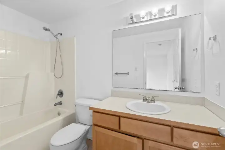 One of the upper floor full baths.