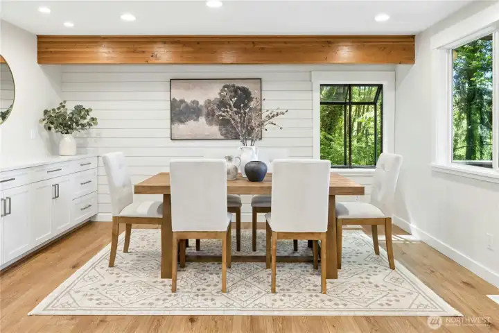 The casual dining space (or family room)  is adjacent to the kitchen and features plentiful built-in storage.