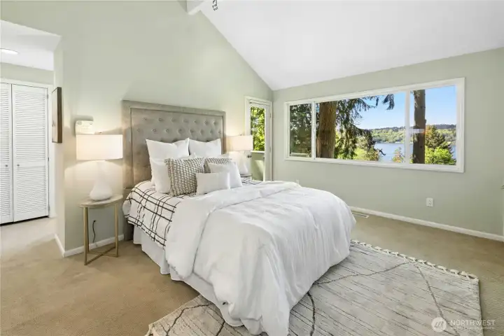 The primary bedroom has vaulted ceilings and treehouse like views.