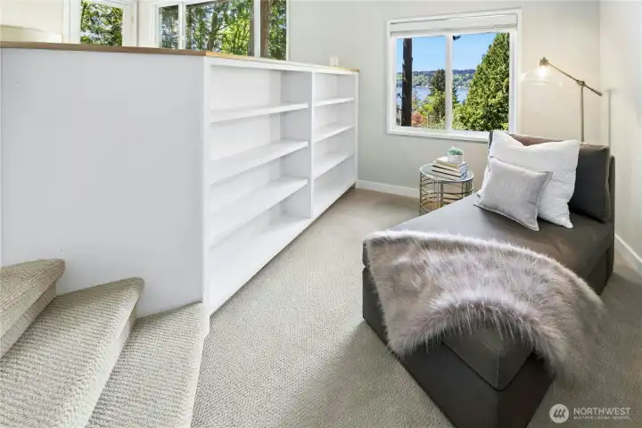 In the primary suite you’ll find this bookcase lined nook perfect for a reading area or desk.