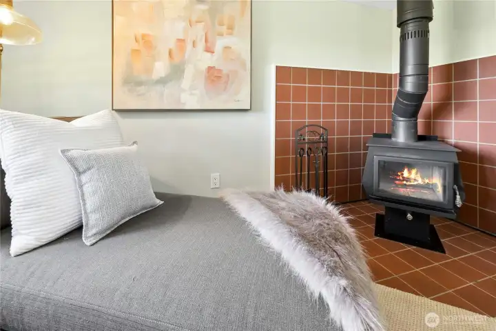 The woodstove adds warmth and ambience to cool winter evenings.