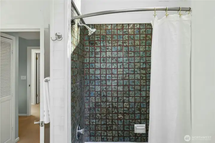 Vintage tile adds personality to the primary bathroom.