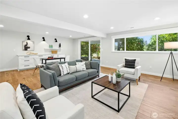 The lower level rec room has a sliding glass door out to a patio and tons of built-in cabinets!