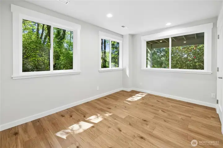 This lower level flex room could be an exercise space or overflow guest quarters.
