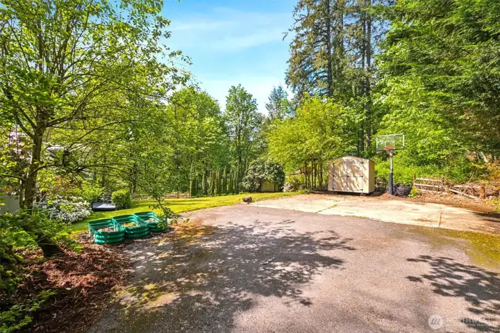 There used to be a two car detached garage in this area, that was taken down when the current owners bought the property. The cement pad is still there and comes in handy as a sports court, or additional place for parking. It would also be easy to permit a new structure since one was there prior.