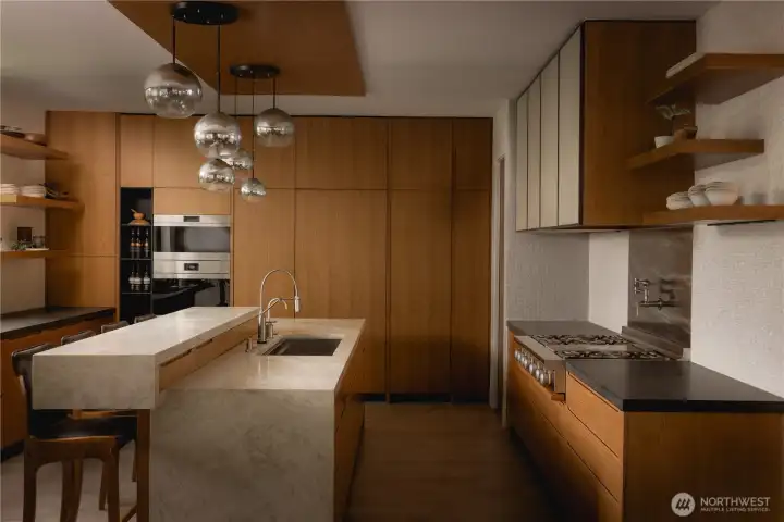 The kitchen becomes a point of focus, shaped by a carefully considered material palette.