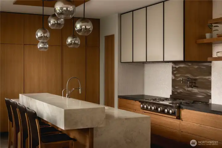 Bookmatched walnut and etched stone are handled with remarkable precision.