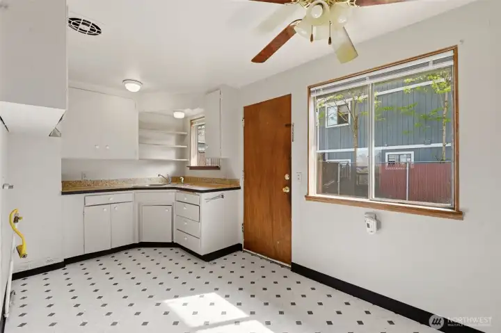 Kitchen and dining area towards back door.