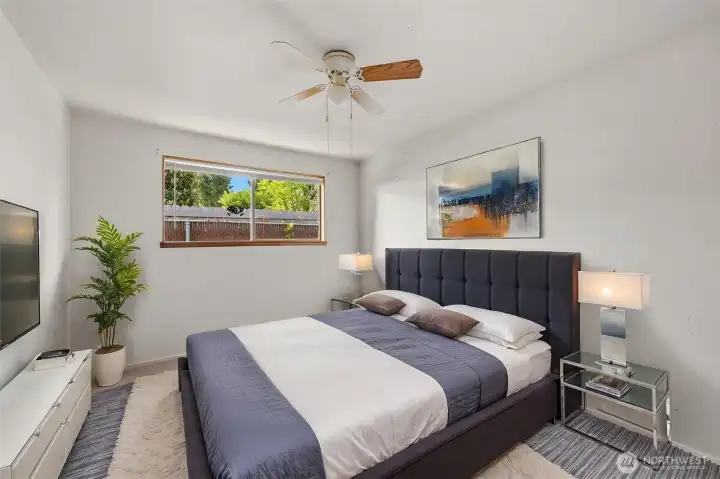 The primary bedroom shown here virtually staged.