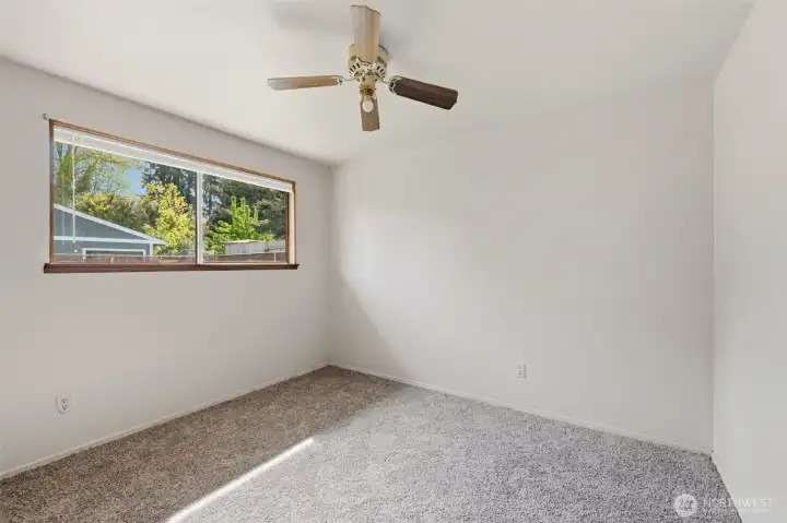 The second bedroom looks out to the backyard and has a nice closet.