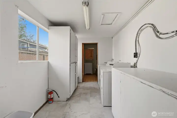 The laundry room also has a storage cabinets  and a locker for each unit.