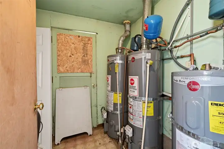 The mechanical room is located at the end of the laundry room.