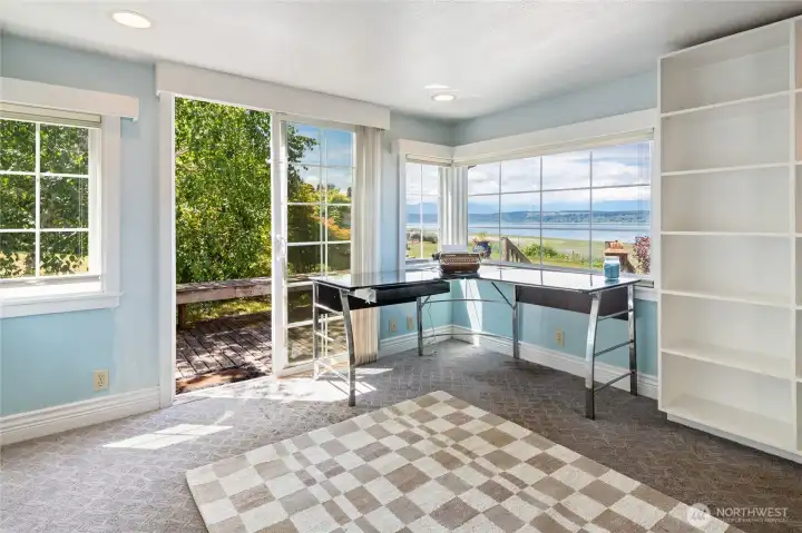 A home office with a Hood Canal view is the ultimate marriage of productivity and natural beauty. A home office with a Hood Canal view is the ultimate marriage of productivity and natural beauty.