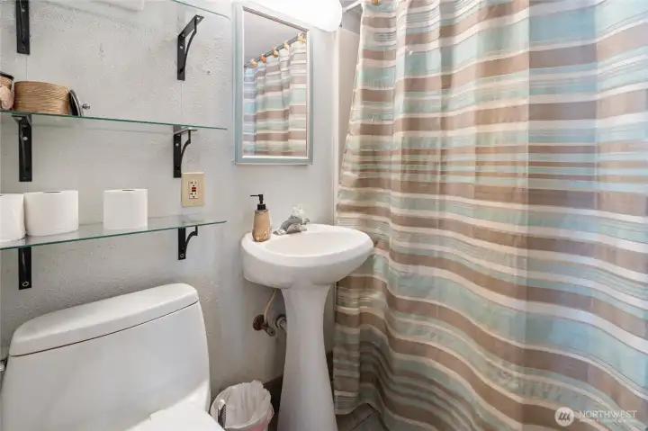 The cabin also features a full bath just off the kitchen. The cabin also features a full bath just off the kitchen.