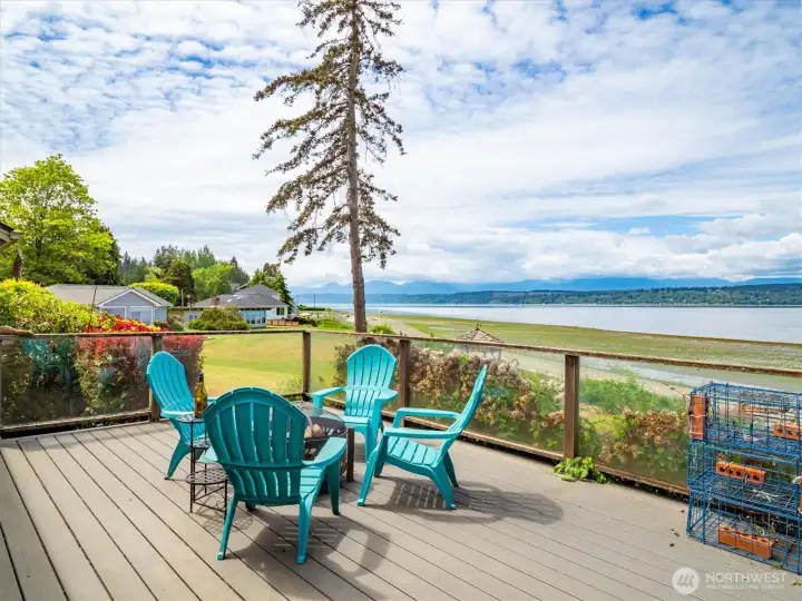 Take it all in, all year long: The back deck is the ultimate spot to gaze out at Hood Canal, the mountains, and more. Take it all in, all year long: The back deck is the ultimate spot to gaze out at Hood Canal, the mountains, and more.