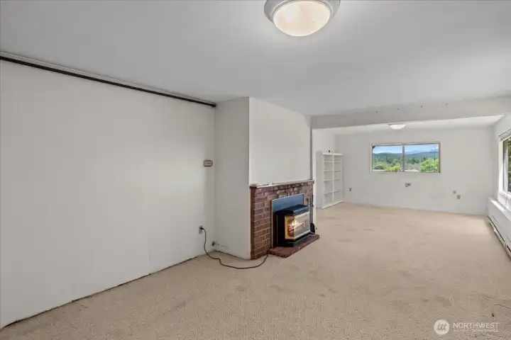 Rec room on lower level with a gas fireplace.