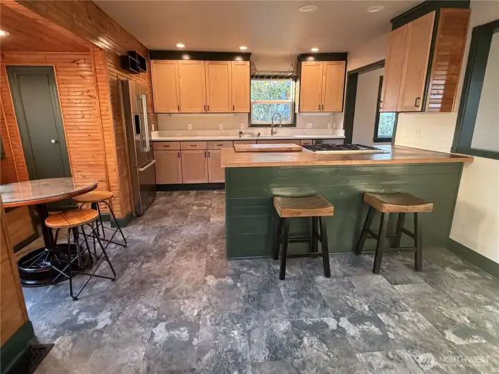 Open layout kitchen with bar seating Open layout kitchen with bar seating