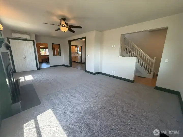 Back of living room leading to upstairs and dining/kitchen area Back of living room leading to upstairs and dining/kitchen area