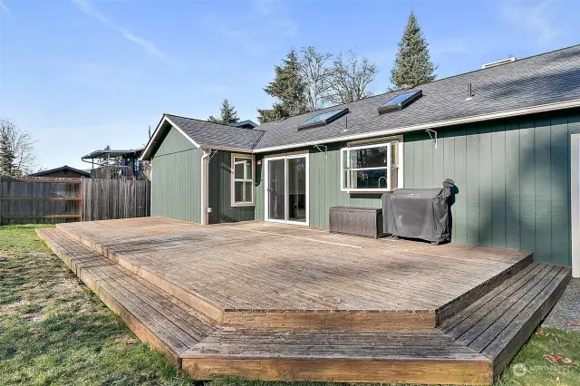 The large deck off the dining room allows you to entertain outside comfortably. The open floor plan between the dining room and the deck also makes it easy to go in and out.