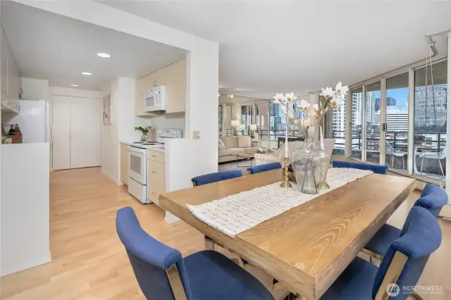 Enjoy an open floor plan with expansive windows, perfect for entertaining, dining, and taking in stunning views of Seattle from above.