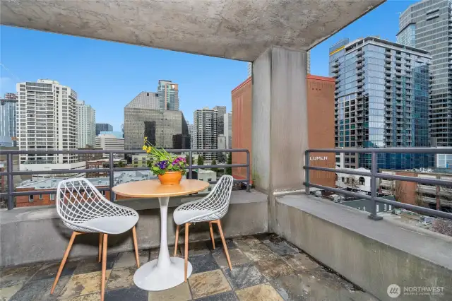 The outdoor patio seamlessly blends indoor-outdoor living, with downtown Seattle as your backdrop.