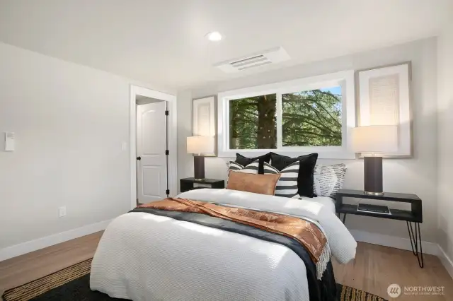 Primary bedroom with walk-in closet and individualized climate control